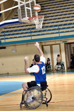 basketball player in wheelchair with ball in action